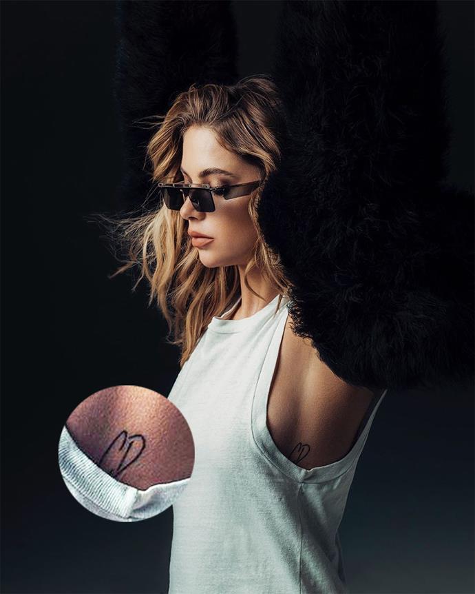 **Ashley Benson**
<br><br>
While promoting her eyewear collection [with Privé Revaux](http://go.pagesix.com/?id=93051X1547100&isjs=1&jv=14.2.0-stackpath&sref=https%3A%2F%2Fpagesix.com%2F2019%2F07%2F23%2Fashley-benson-gets-personal-with-new-fashion-collaboration%2F&url=https%3A%2F%2Fpriverevaux.com%2Fcollections%2Fprive-revaux-x-benzo&xguid=01DKJYFMQRF3E63B7EKRM00AB0&xs=1&xtz=-600&xuuid=03f21d30a98405e30f358c1847355c71&abp=1&xjsf=other_click__contextmenu%20%5B2%5D|target="_blank"|rel="nofollow"), Ashley Benson showed off a new tattoo of [ex-girlfriend](https://www.elle.com.au/celebrity/cara-delevingne-ashley-benson-breakup-reason-23462|target="_blank") Cara Delevingne's initials on her ribcage.