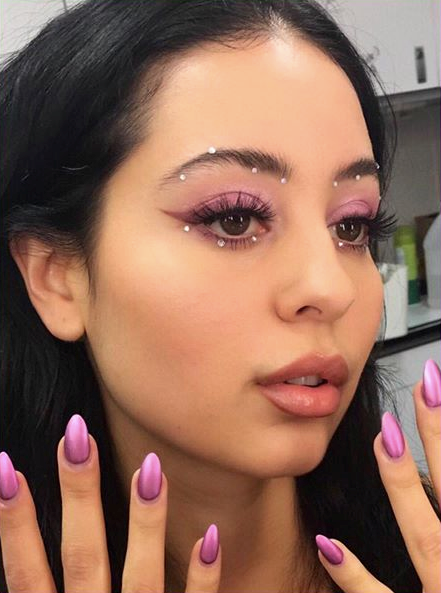 Maddy's perfectly coordinated mauve eye lids and nails.