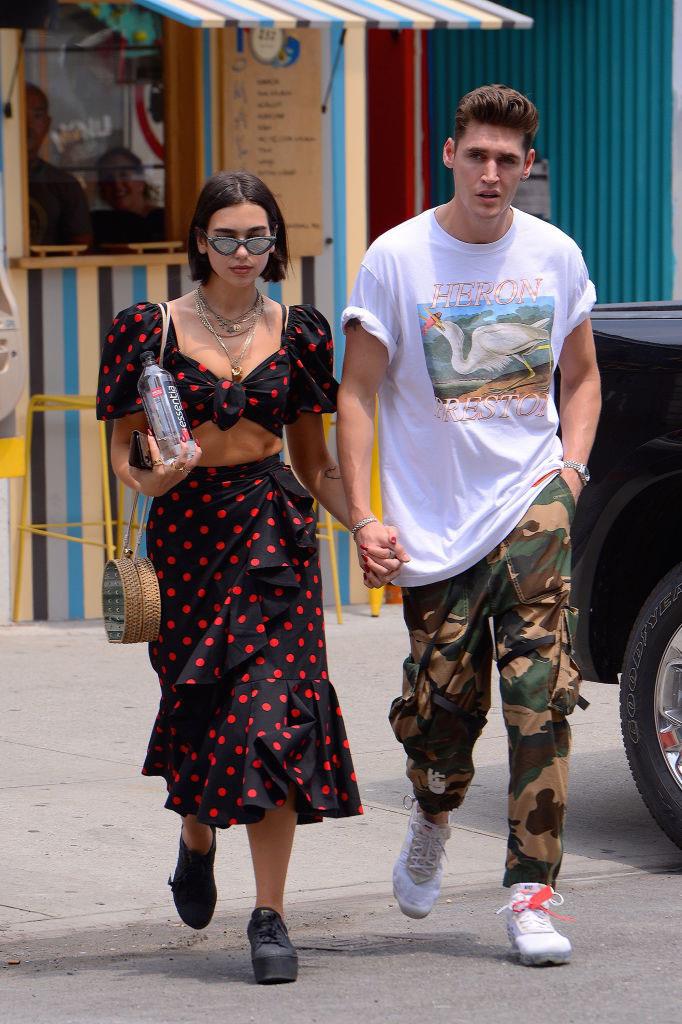 **Dua Lipa and Isaac Carew** <br><br>
After dating on-and-off since 2013, Dua Lipa split from her boyfriend, Isaac Carew, in June 2019. Later in the year, she began dating Anwar Hadid, the 20-year-old brother of supermodels Gigi and Bella Hadid. <br><br>
Of her split with Carew, a source told U.K. newspaper *[The Sun](https://www.thesun.co.uk/tvandshowbiz/9227233/dua-lipa-and-boyfriend-isaac-carew-break-up-18-months-after-reconciling/|target="_blank"|rel="nofollow")*: "They wanted to make things work and things were great between them for a while but she is just getting busier and busier. She is gearing up to release new music and has basically been performing across the world non-stop for the past three years so it's been tough."