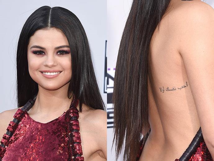 **SELENA GOMEZ**<br><br>

Inked by celebrity tattooist Keith Scott ["Bang Bang"](https://www.instagram.com/bangbangnyc/|target="_blank"|rel="nofollow") McCurdy in 2014, Gomez's back tattoo [means](https://www.eonline.com/news/560392/selena-gomez-gets-a-new-tattoo-see-pics-and-find-out-the-meaning|target="_blank"|rel="nofollow") "Love Yourself First" in Arabic.