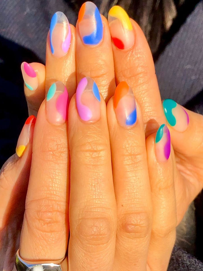 Don't be afraid to swap classic brights for cheeky neons.<br></br>
*Image via: @nailsbymh*
