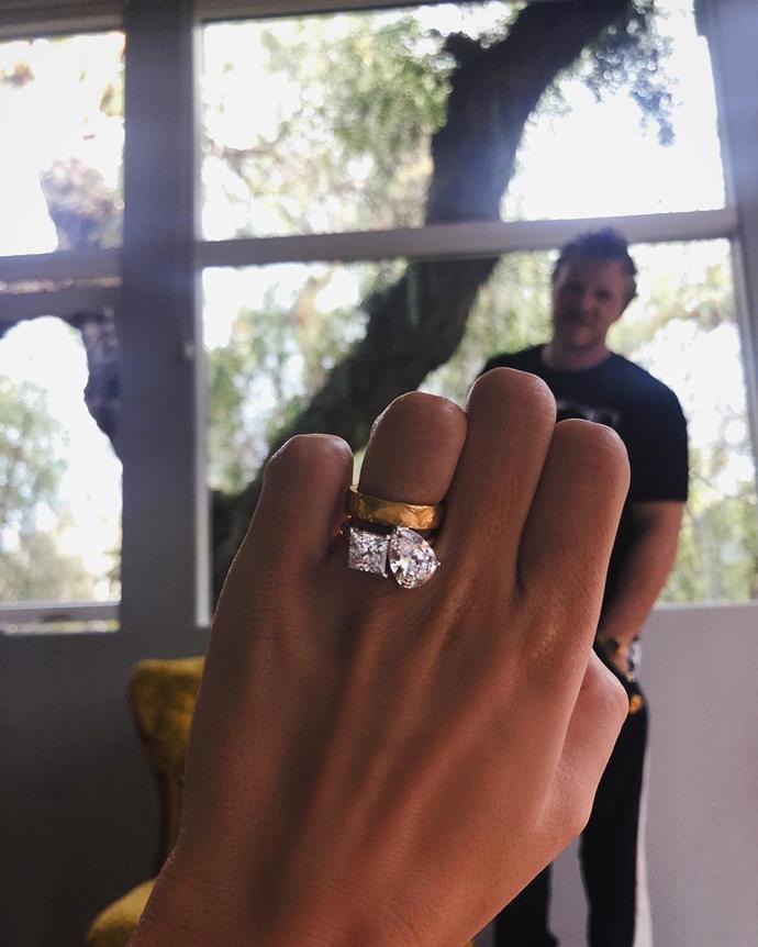 **Emily Ratajkowski**<br><br>

Emily Ratajkowski showing off her [unconventional engagement ring](https://www.harpersbazaar.com.au/bazaar-bride/unconventional-celebrity-engagement-rings-13152|target="_blank") with her now-husband Sebastian Near-McClard in the background, in July 2018.<br><br>

*Image via @emrata*