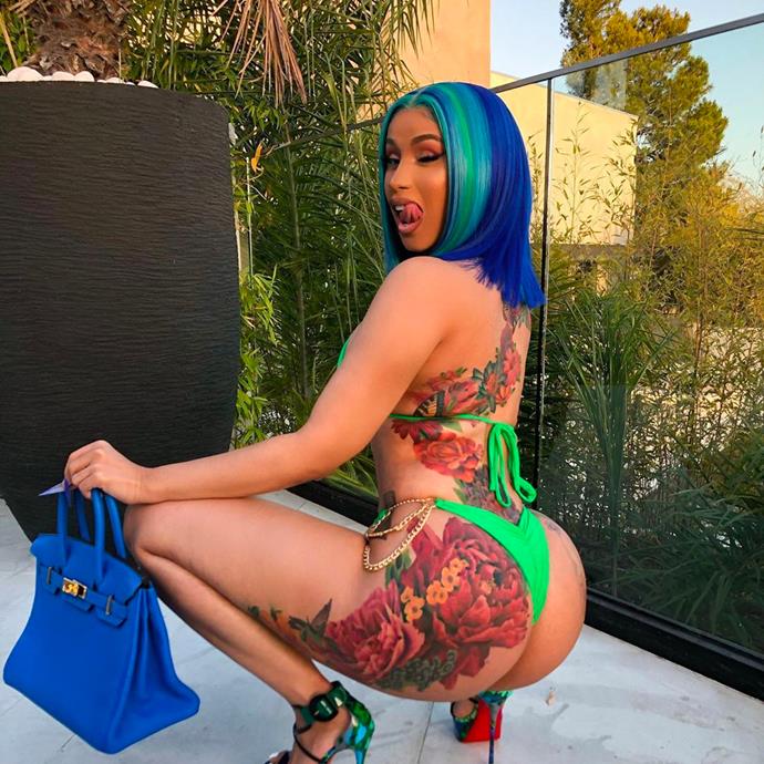 **Cardi B**
<br><br>
Recently, Cardi also added a giant butterfly mural that travels from her right shoulder, down her back, and finishes on her left thigh.