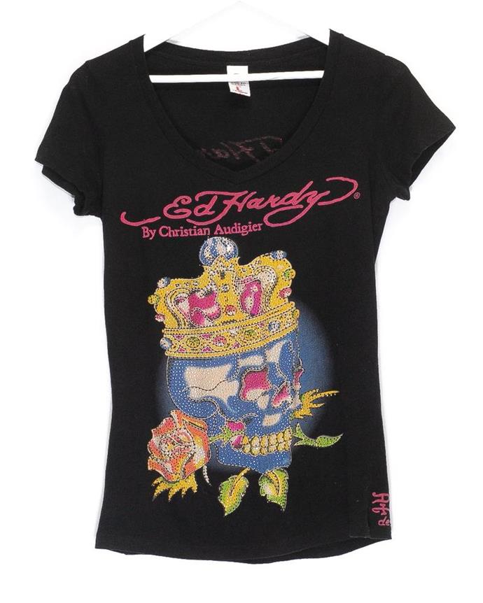 **Ed Hardy Tops**
<br><br>
From its rhinestones to its rose-centric illustrations, even It-couple [Chrissy Teigen and John Legend](https://www.instylemag.com.au/john-legend-chrissy-teigen-ed-hardy|target="_blank"|rel="nofollow") couldn't resist the allure of an Ed Hardy garment. For the teenagers of the early '00s, there was something about an Ed Hardy singlet top that screamed 'cool'.