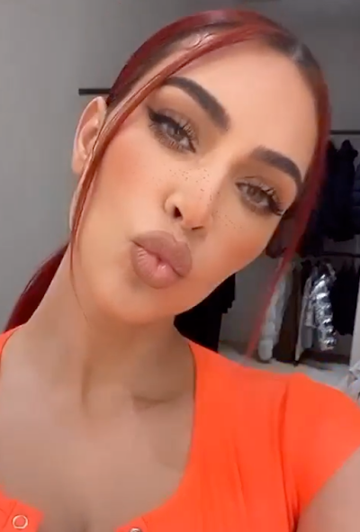 **Kim Kardashian West**<br></br>
Kardashian West is vibing visible roots with her choc-and-cherry colour.