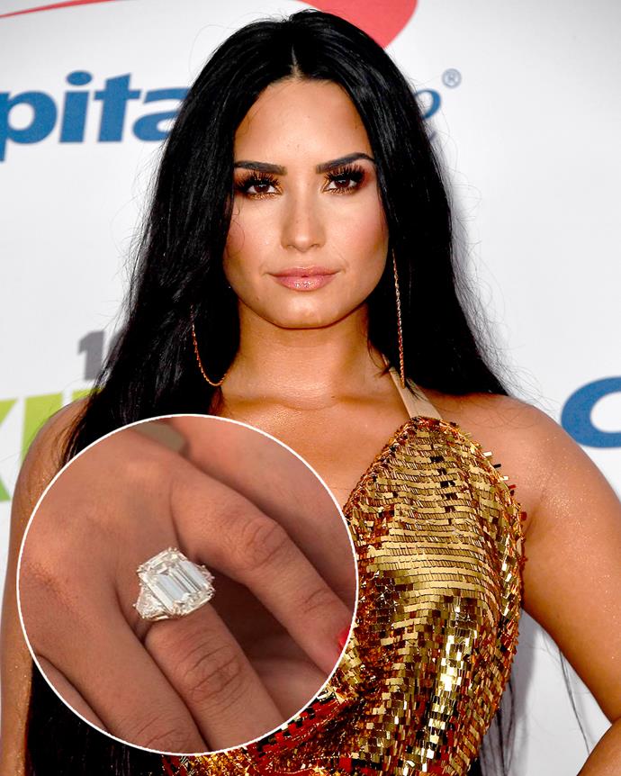**The wearer:** Demi Lovato<br><br>
**The ring:** A 10-carat emerald-cut diamond, flanked by two trapezoid-shaped baguettes, set on platinum.<br><br>
**The pricetag:** $3.4 million AUD