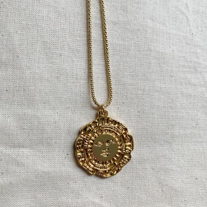 'Signum' Gold Plated Pendant Necklace, $290 at [Albus Lumen](https://www.albuslumen.com/collections/jewellery/products/signum-gold-plated-pendant-necklace|target="_blank"|rel="nofollow").