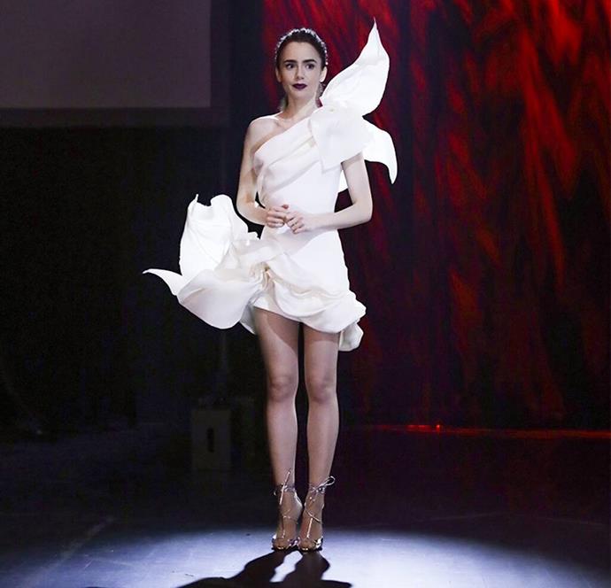 **7. Emily's Pierre Cadault Moment**<br><br>

While the show clearly borrowed 'inspiration' from Viktor & Rolf to create the Pierre Cadault 'collection', this sculptural couture gown is actually by Stéphane Rolland. And even though it's not an Emily outfit *per se*, she looks *incroyable*.<br><br>

*Le mood:* The calm before the (paint) storm.