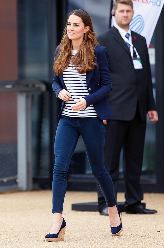 **CATHERINE, DUCHESS OF CAMBRIDGE**
<br><br>
Kate Middleton is a true professional when it comes to casual attire for less formal events. This time, she paired denim jeans with a navy blazer after attending a SportsAid Athlete Workshop in London, back in 2013.