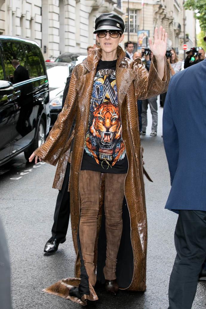 Celine Dion going shopping in a Balmain snakeskin coat, brown leather thigh-high boots and a t-shirt.
