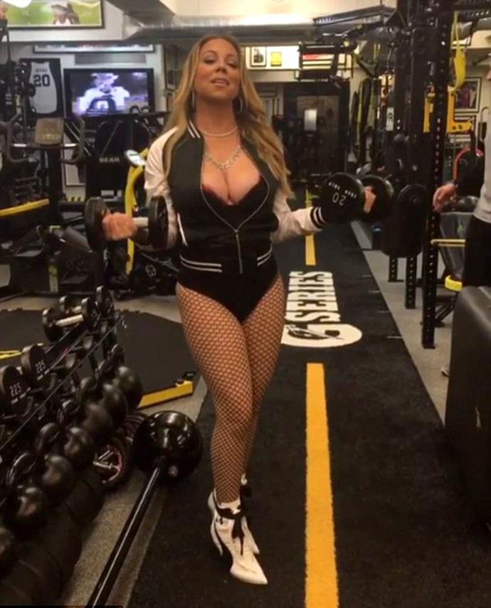 Mariah Care working out in jewellery, fishnets and high heels.