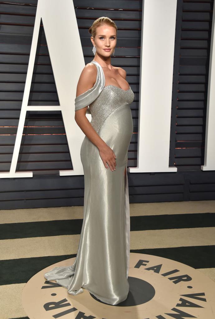 **Rosie Huntington-Whiteley, 2017**
<br><br>
Always bringing elegance to any red carpet she graces, Rosie Huntington-Whiteley debuted her baby bump in a shimmering Versace gown.