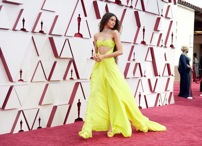 A lemon-lime dream at this custom Valentino dress and Jimmy Choo heels at the 2021 Academy Awards.