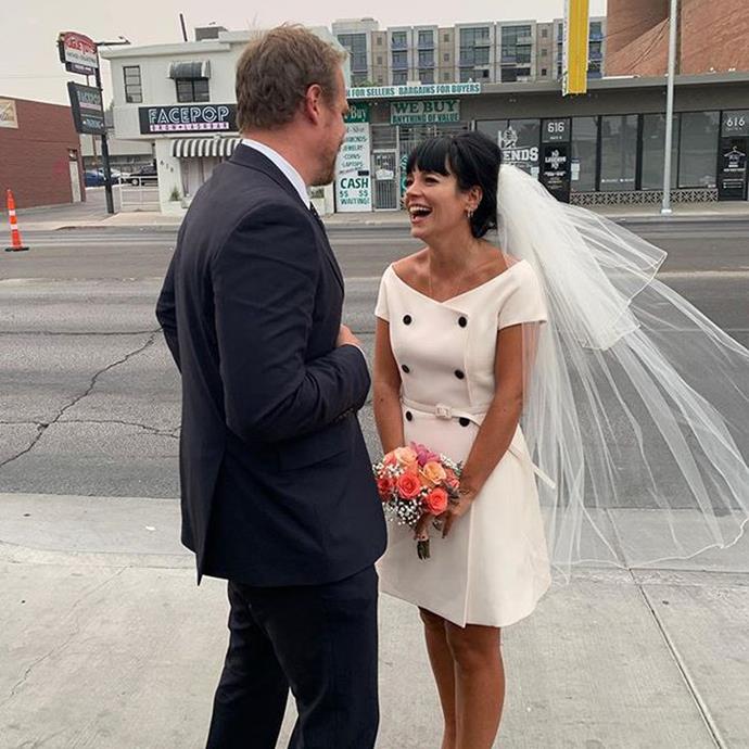 **Lily Allen in Christian Dior (2020)**<br><br>
Lily Allen was quite possibly the biggest mood of all time when she married *Stranger Things* actor David Harbour in Las Vegas. After the ceremony, they headed straight to In-N-Out Burger to feast on fries. She kept the double-breasted mini dress on while she chowed down on a cheeseburger, and the pictures are truly iconic.