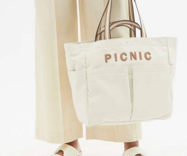 Anya Hindmarch Household Picnic recycled-canvas tote bag, $375 from [Matches Fashion](https://www.matchesfashion.com/au/products/Anya-Hindmarch-Household-Picnic-recycled-canvas-tote-bag-1417338|target="_blank") 

