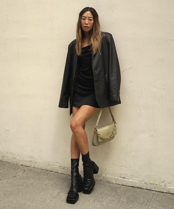 Aimee Song channels 90s minimalism wearing CHARLES & KEITH Zadie Padded Shoulder Bag and Lucile Platform Calf Boots.