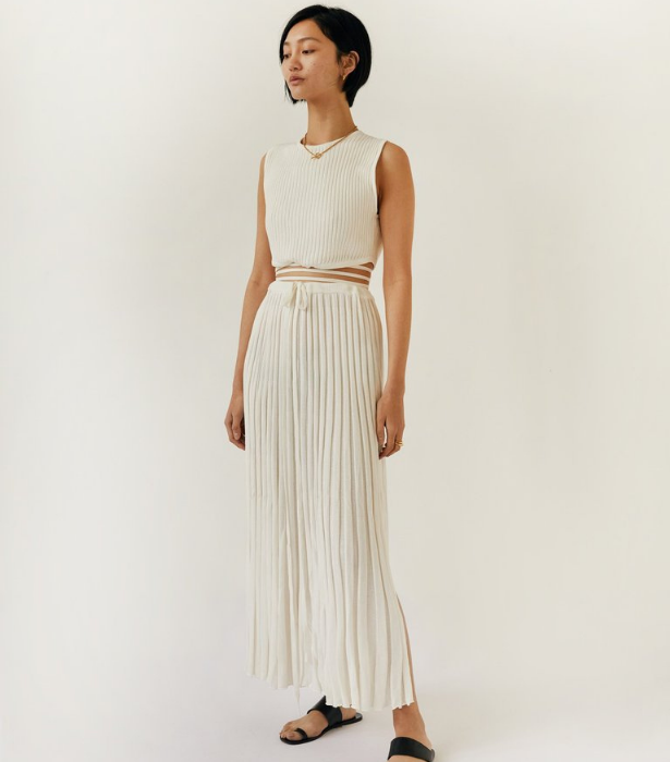 **Christopher Esber Pleated Knit Tie Skirt, $550 from [The Undone, shop here](https://www.theundone.com/collections/christopher-esber/products/pleated-knit-tie-skirt-natural|target="_blank")** 

**Christopher Esber Sleeveless Knit Tie Crop, $440 from [The Undone, shop here](https://www.theundone.com/collections/christopher-esber/products/sleeveless-knit-tie-crop-natural|target="_blank")** 
