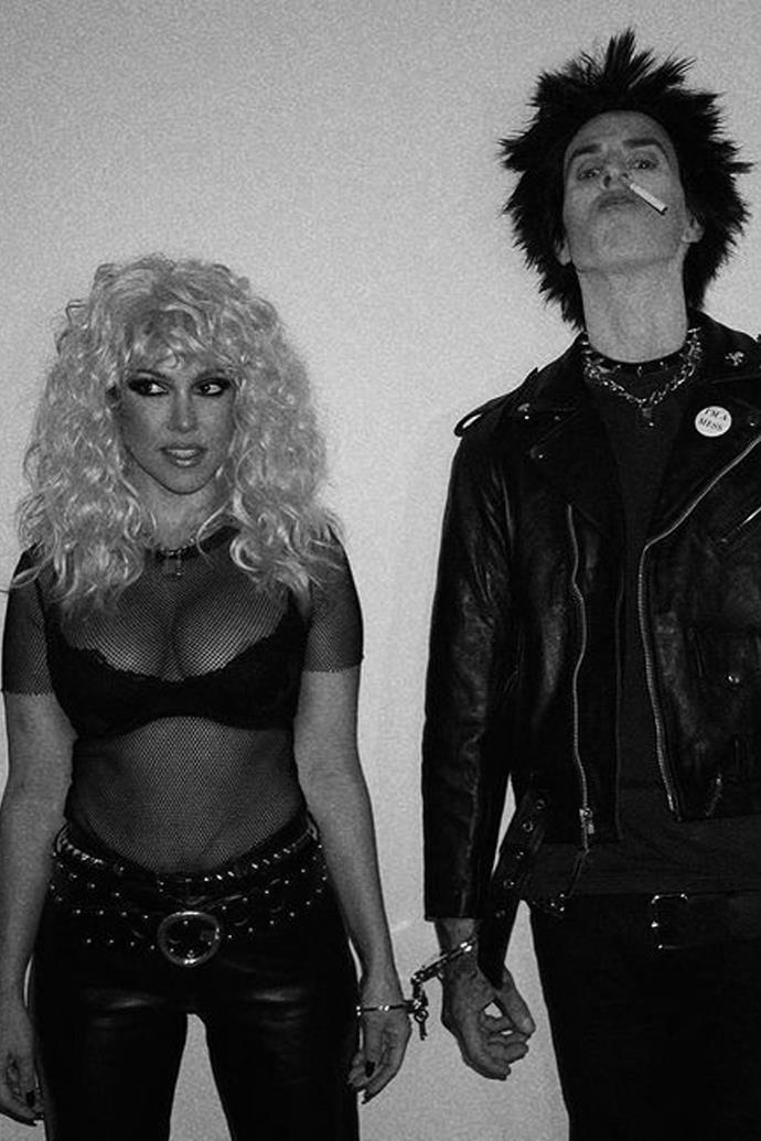 **Kourtney Kardashian and Travis Barker** as Nancy Spungen and Sid Vicious from the *Sex Pistols*