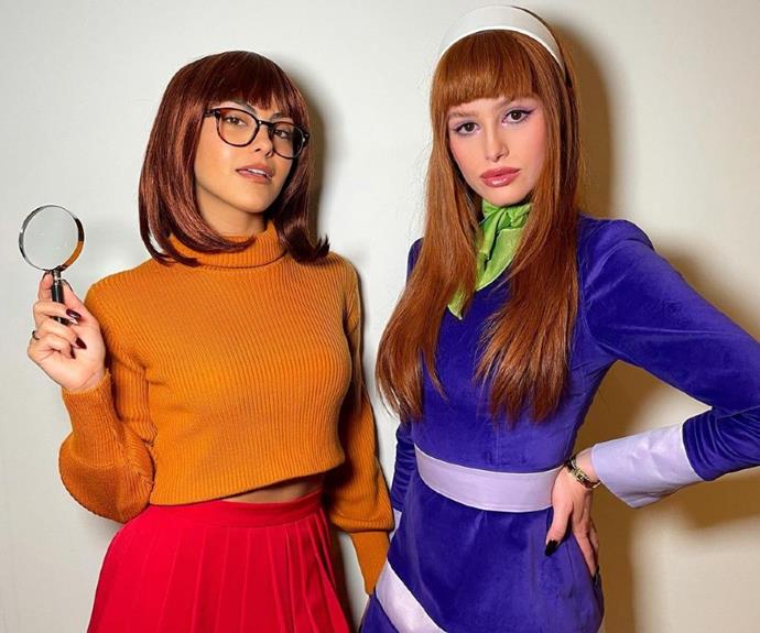 **Camila Mendes and Madelaine Petsch** as Velma and Daphne from *Scooby Doo*
