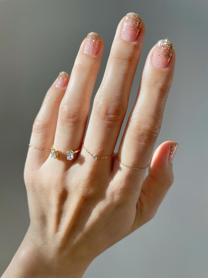 **PINK AND SPARKLY**
<br><br>
"We have seen a lot of pink sparkly nails this year," Papadopoulos reveals. "Not large glitter but a soft sparkle to the polish. It looks really sweet with a sparkly diamond."
<br><br>
*Image: [@lulus](https://www.instagram.com/lulus/|target="_blank"|rel="nofollow")*