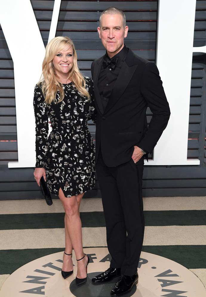**Reese Witherspoon & Jim Toth**
<br><br>
Reese Witherspoon has a striking presence no amount of height would change (she's 5'2", for the record), and while her husband Jim Toth's height of 6'1" is much taller on paper, you barely notice it when they're together.