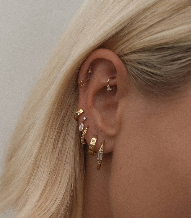 Right to left from S-kin Studio: [Caroline Baguette Hoops](https://s-kin.com.au/collections/ear/products/caroline-baguette-hoop|target="_blank") ($259), [Aurora Bold Gemstone Hoops](https://s-kin.com.au/collections/ear/products/aurora-bold-gemstone-hoops|target="_blank") ($119), [Madame Blanche Huggie Hoops](https://s-kin.com.au/collections/ear/products/madame-blanche-huggie-hoops|target="_blank") ($107), [Rei Marquise Dangle Single Stud](https://s-kin.com.au/collections/ear/products/rei-marquise-dangle-single-stud|target="_blank") ($67), [Aurelia Gemstone Huggie Hoops](https://s-kin.com.au/collections/ear/products/aurelia-gemstone-huggie-hoops|target="_blank") ($87), [Faye Wishbone Single Stud](https://s-kin.com.au/collections/ear/products/faye-wishbone-single-stud|target="_blank") ($65), [Trinity Single Stud](https://s-kin.com.au/collections/ear/products/trinity-single-stud|target="_blank") ($45), [Mina Trio Gemstone Hoop](https://s-kin.com.au/collections/ear/products/mina-trio-gemstone-hoop-1|target="_blank") ($82)