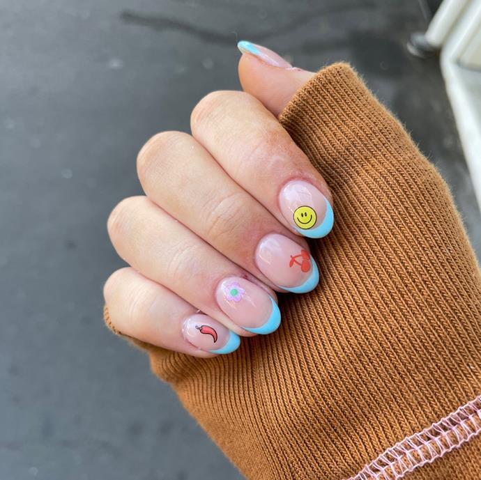 **Stickerbook Nails**
<br><br>
Grab your childhood sticker book and give your nails the throwback treatment with this 2022 trend. An easy DIY, opt for a selection of fun nail stickers and apply to manicured fingertips or neutral nails.
<br><br>
*Image: [@flowerbed_nails](https://www.instagram.com/p/CVR_rftDw60/|target="_blank"|rel="nofollow")*