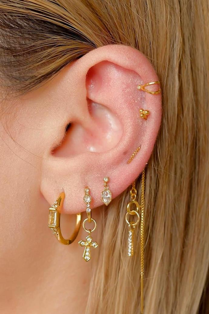 ***In: Stacked Up Ears***
<br><br>
An oldie but a goodie, [stacked up ears](https://www.elle.com.au/fashion/how-to-ear-stack-earrings-26343|target="_blank") are climbing back into the limelight in 2022. The trend of jewelling up your ear lobes is far from new, nor has it adapted into anything more interesting than when it first entered the mainstream. But are we still headed to the piercing studio for new additions? Well, yes. Excessive earrings don't look to be going anywhere, anytime soon, so it's time to sell any free real estate on your ears. 
<br><br>
*Image: [@skinstudioj_](https://www.instagram.com/skinstudioj_/|target="_blank"|rel="nofollow")*