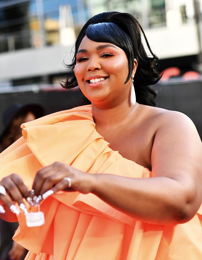 **Lizzo**
<br><br>
No one has lashes as fluttery as Lizzo, but she'd be the first to credit a perfect pair of false lashes for her most flirtatious looks. At the 2019 Grammy Awards, makeup artist Alexx Mayo revealed that he loves to pair a full face of Charlotte Tilbury products with a $16 pair of faux-mink falsies by KISS for the "Good As Hell" singer.