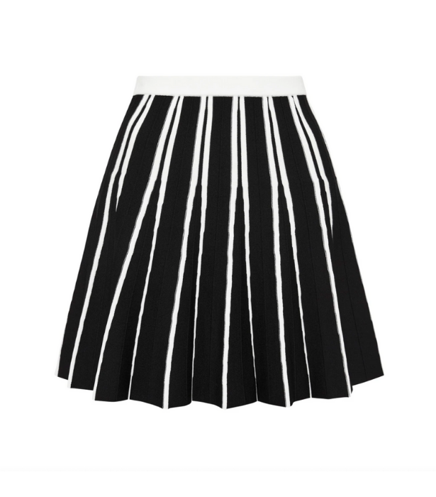 Athletica Pleated Knit Mini Skirt, $175 at [Aje](https://ajeworld.com.au/products/pleated-knit-mini-skirt-611-black-white?|target="_blank")