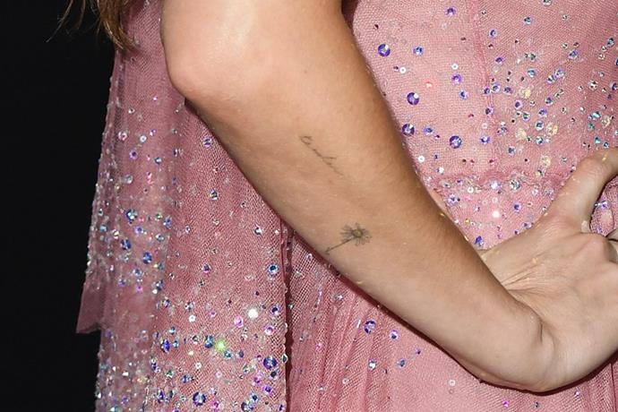 Actress Dakota Johnson has several dainty tattoos, including two on her right forearm. One is a dying sunflower, which is represents the effects of climate change, and is a reminder to respect the planet. The other, si the word 'tender' written in cursive, which she declared to be her favourite word.