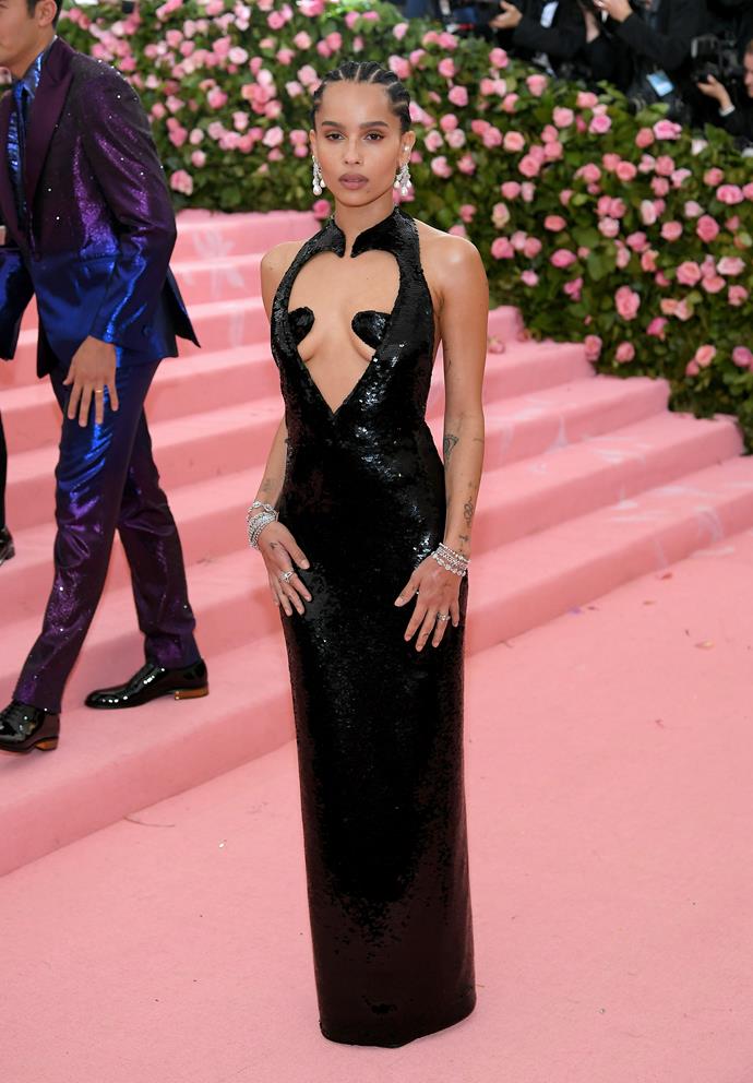 It's serving camp! Years before the black, bodycon cutout dress was in fashion, Zoë took this trend to the mainstream by wearing this dazzling black gown with an exaggerated love heart cut out to the 2019 Met Gala.