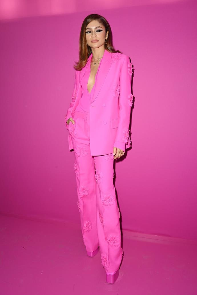 Zendaya is pretty in pink in the front row at the Valentino Fall/Winter 2022 show during Paris Fashion Week. 
<br><br>
While this suit is straight fire, we need to take a moment for these iconic pink platforms. Zendaya and Valentino are a match made in heaven.