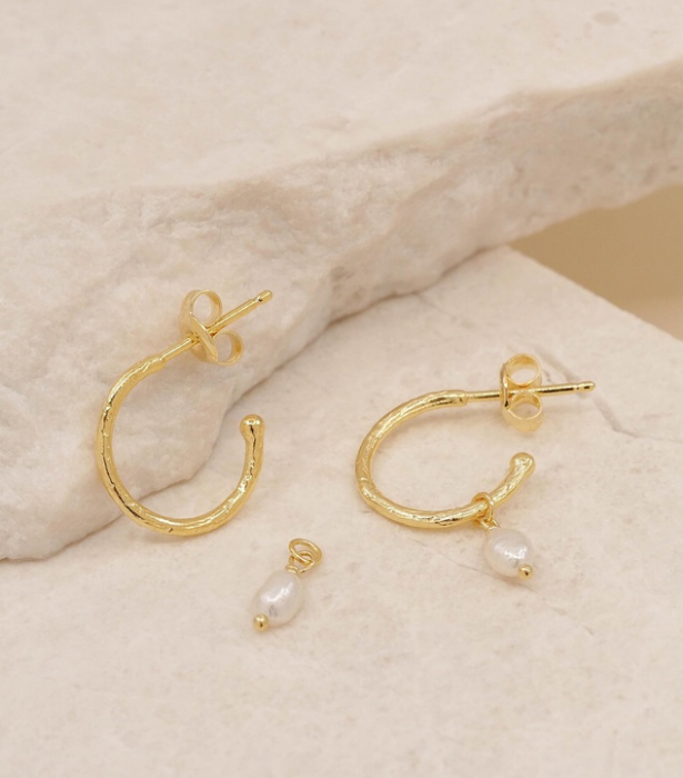 [By Charlotte Eternal Peace Gold Hoop Earrings with Fresh Water Pearl](https://www.theiconic.com.au/eternal-peace-gold-hoop-earrings-with-fresh-water-pearl-966273.html |target="_blank"), $159 
