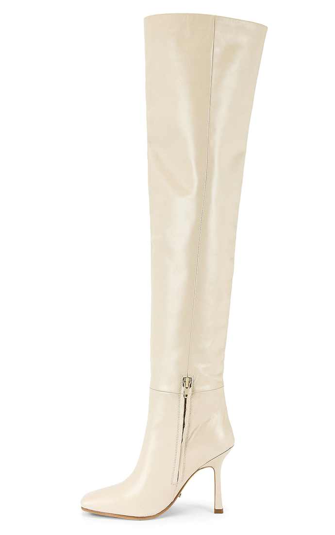 Tony Bianco Halo Boot in Vanilla, $727 at [REVOLVE](https://www.revolveclothing.com.au/tony-bianco-halo-boot/dp/TONR-WZ372/?d=Womens&page=1&lc=2&plpSrc=%2Fr%2FBrands.jsp%3FaliasURL%3Dshoes-boots-over-the-knee%2Fbr%2Ff0a241%26sc%3DBoots%26s%3Dc%26c%3DShoes%26ssc%3DOver+The+Knee%26color%3Dwhite%26filters%3Dcolor%26sortBy%3Dfeatured&itrownum=1&itcurrpage=1&itview=05|target="_blank"|rel="nofollow")