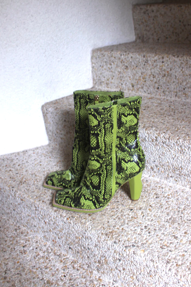 Serpentine High Heel Boot, $395 at [Aje](https://ajeworld.com.au/products/serpentine-high-heel-ankle-boot-green-snake-effect|target="_blank"|rel="nofollow")