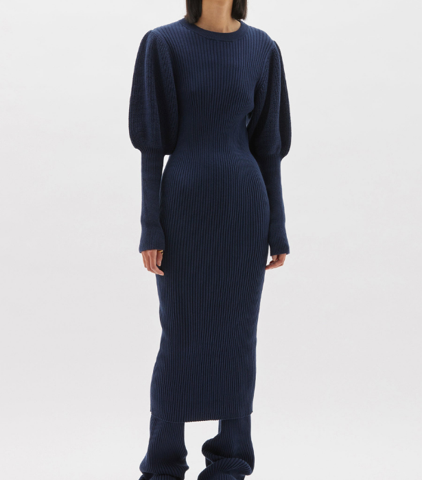Balloon Sleeve Knit Midi Dress, $480 at [Bassike](https://www.bassike.com/collections/women-dresses/products/balloon-sleeve-knit-midi-dress-pc22wk13-navy|target="_blank"|rel="nofollow")