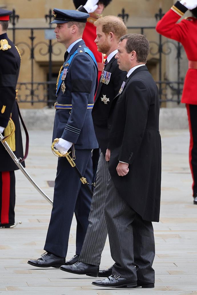 Prince William and Prince Harry walking in the Royal procession at Queen Elizabeth II's funeral.