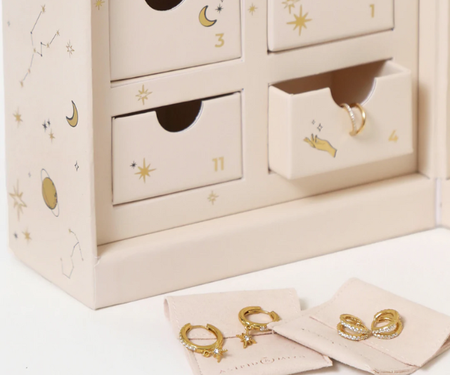 **12 Day Advent Calendar In Gold, $529 at [Astrid & Miyu](https://www.astridandmiyu.com/products/2022-12-day-advent-calendar-box-in-gold|target="_blank"|rel="nofollow")** <br><br>
This whimsical calendar features the brands best-selling hoops, huggies, studs and ear cuffs to you can elevate your [ear stack](https://ellaau.com/fashion/cartilage-earring-jewellery-australia-26708|target="_blank") come 2023. Choose between gold or silver as well as picking your birthstone colour for your custom pair of huggies. <br><br>
[SHOP NOW](https://www.astridandmiyu.com/products/2022-12-day-advent-calendar-box-in-gold|target="_blank"|rel="nofollow")