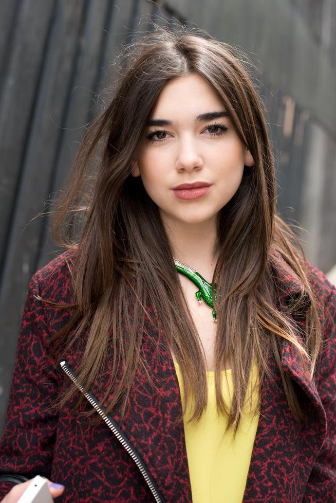 A baby faced Dua appears at a London fashion show in June 2013. She's all about that natural hair and minimal makeup.