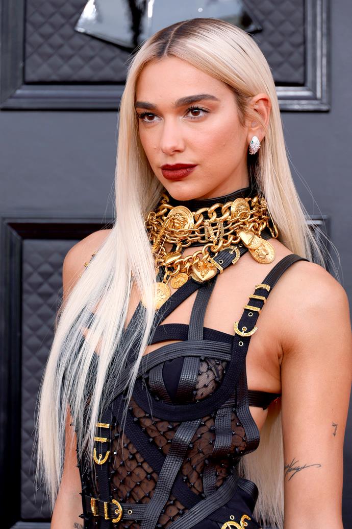 By April 2022, Dua was back with the blonde look, this time committing to it harder than she ever had before. While her dark roots were still subtly visible, this was undoubtedly the blongest the singer had ever been. 
<br><br>
A dark, red lip offset the entire look, with her eye makeup kept minimal to let everything speak for itself.