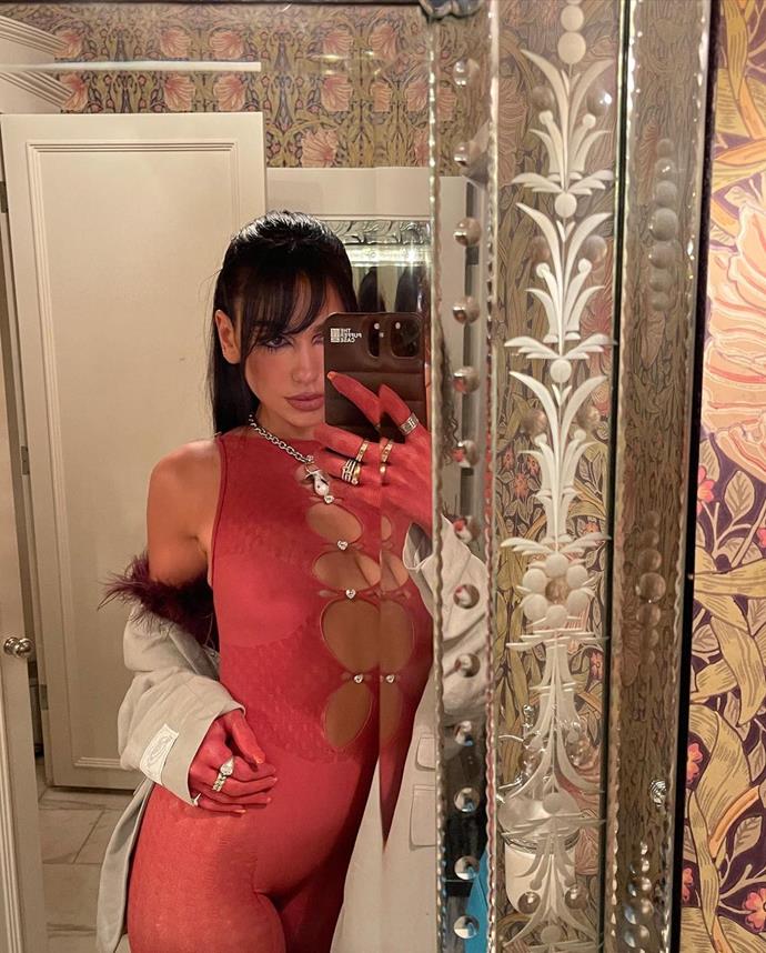 Later that month. Dua cuts bangs for a night out with friends, complete with a red minidress and risqué cutouts.
