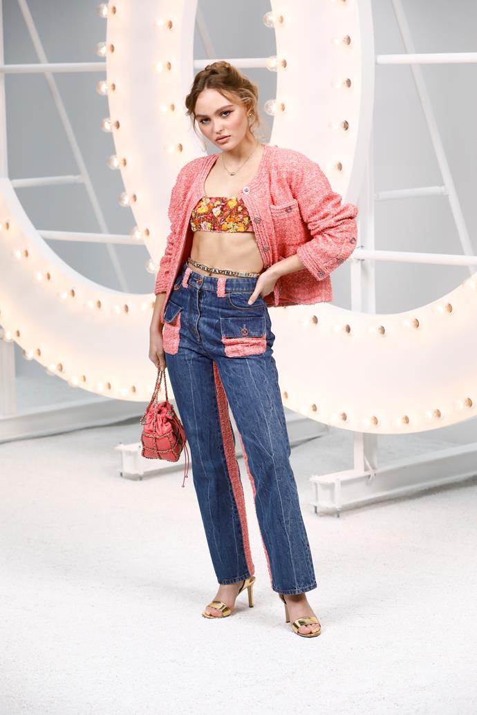 **Chanel Womenswear Spring Summer '21, 2020**
<br><br>
The epitome of French-girl style, Depp seamlessly blended the boundaries between chic and casual, appearing in the maison's iconic bouclé tweed jacket, offset with a floral crop top and embellished jeans.