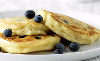 Fluffy Pancakes with Blueberries and Maple Syrup