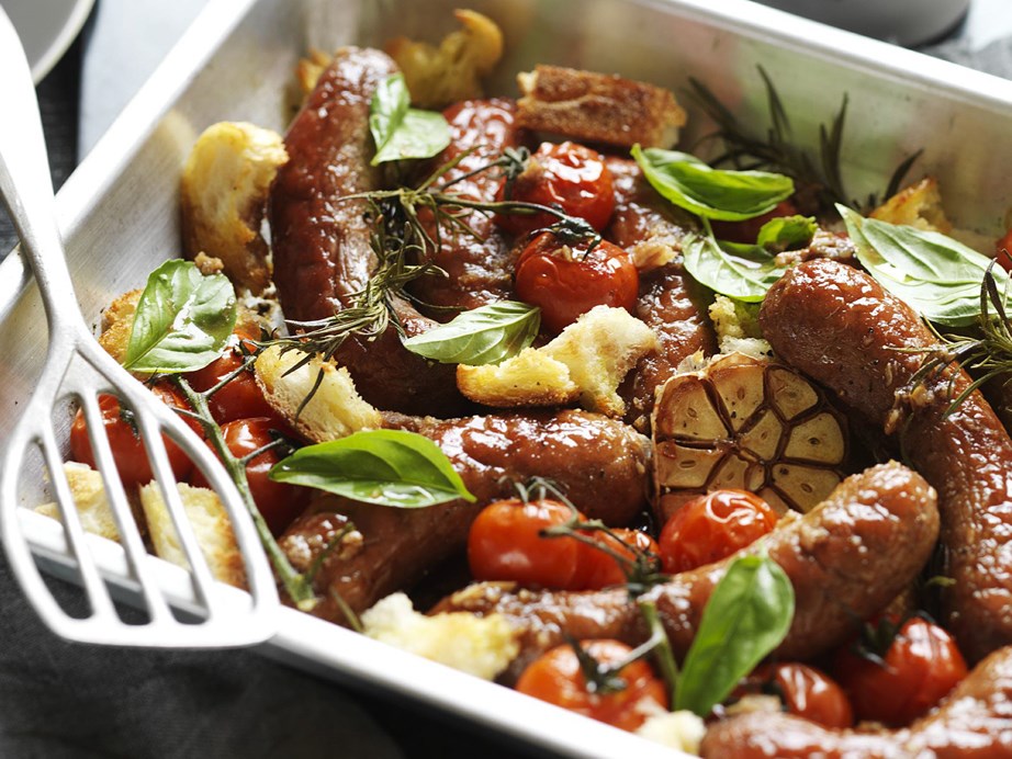 This stunningly simple [baked sausages recipe](https://www.womensweeklyfood.com.au/recipes/baked-beef-sausages-recipe-3690|target="_blank") uses roast garlic, fresh rosemary and basil with a hearty splosh of red wine for a delicious hands-off dinner.