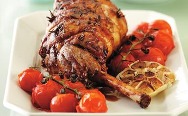 Roast lamb with anchovies, garlic and vegetables