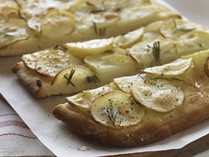 Look away, paleo devotees! Our ancestors would never have indulged in this decadent carb-on-carb fest, but we're sure glad we can. This [potato and rosemary pizza](https://www.womensweeklyfood.com.au/recipes/potato-and-herb-pizzas-6929|target="_blank") served with a herb dressing is so wonderful you won't want to share.