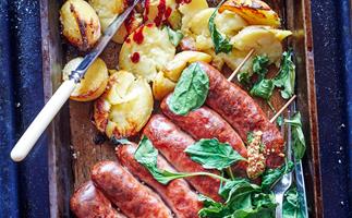Sausages with crushed crispy potatoes