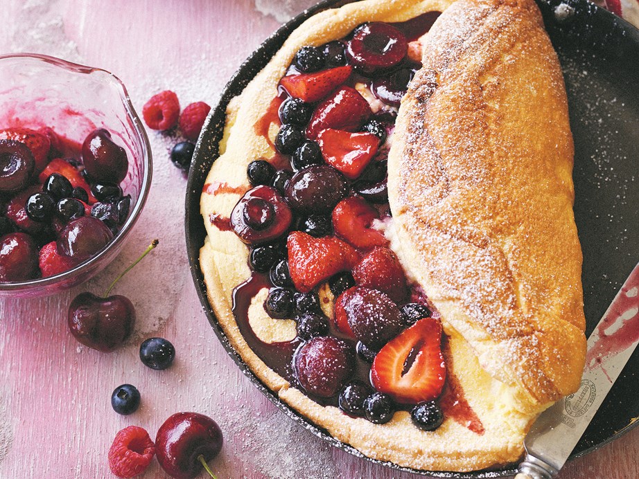 **[Manu Fieldel's sweet omelette souffle with berries](https://www.womensweeklyfood.com.au/recipes/sweet-omelette-souffle-with-berries-1750|target="_blank")**
This gorgeous dessert from Manu Feildel's cookbook, 'More Please!' is definitely one to make when you want to impress your friends. It's easier than a soufflé but just as light, sweet and delicious.

