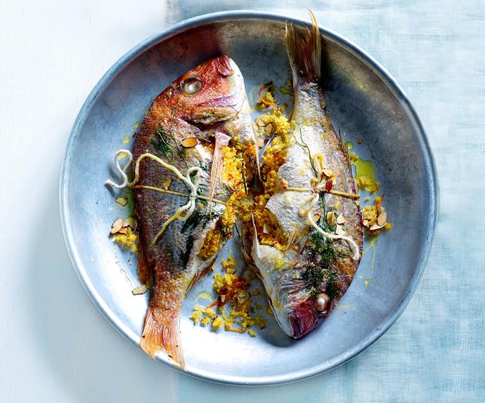 Tray-baked whole fish with citrus couscous stuffing